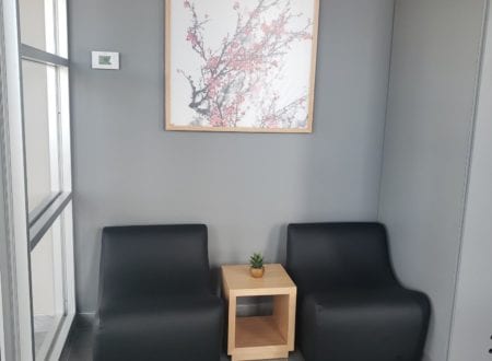 Black chairs and a flower painting in Sushi Shop Vimont restaurant