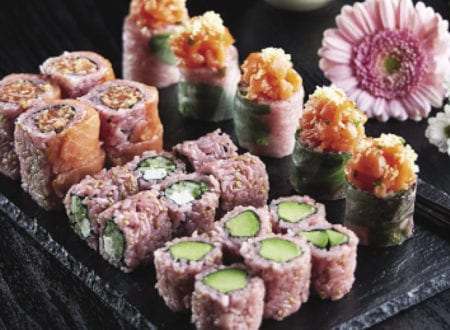 Variety of sushi with pink rice